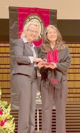 Dr. Rebecca Doerge, Provost presenting Dr. Azita Hirsa with award