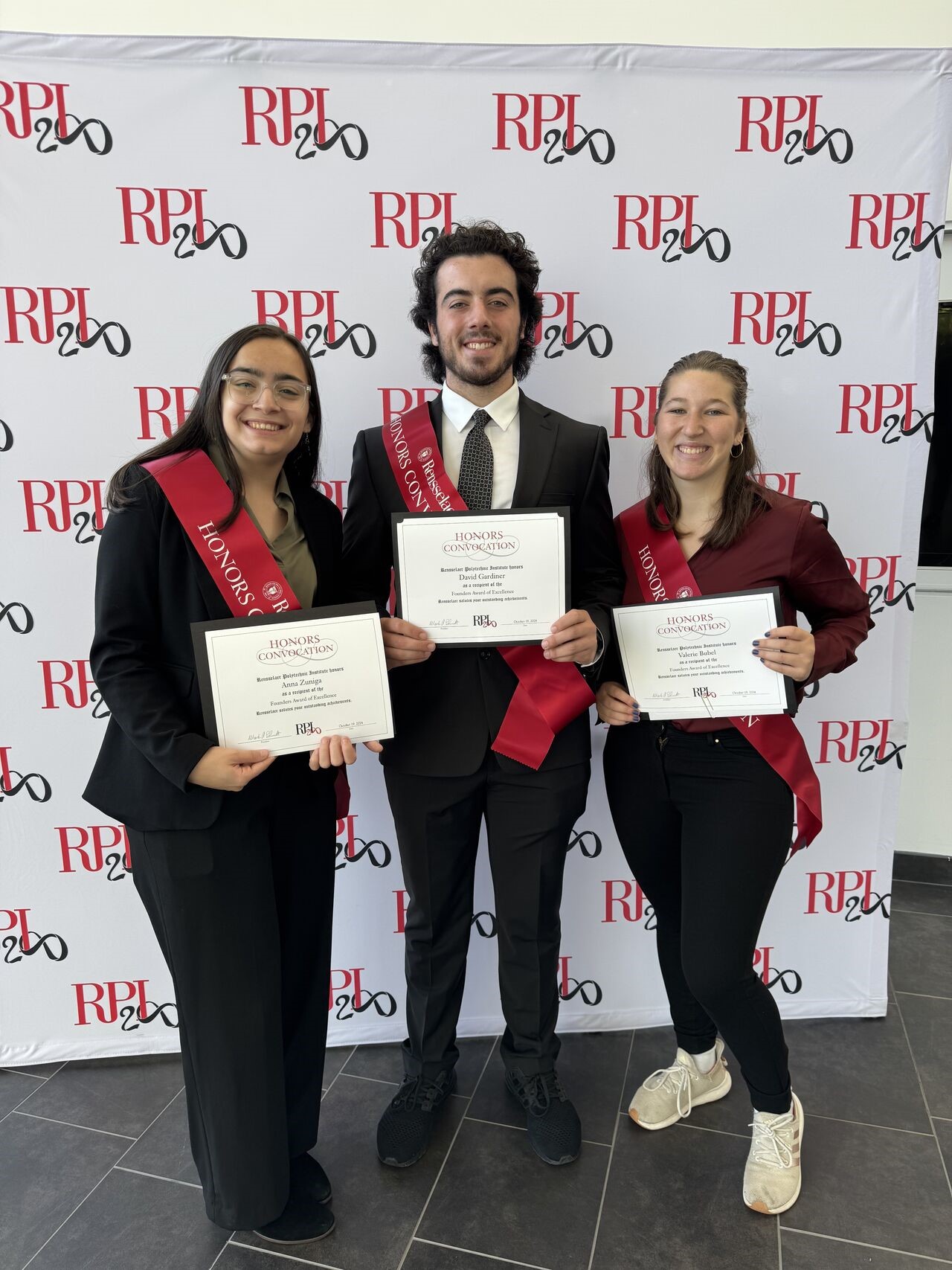 IME students holding Excellence Founders Awards on October 19, 2024